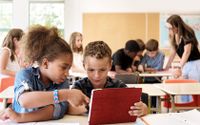 Student helping another student with learning
