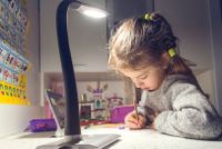 A young girl drawing