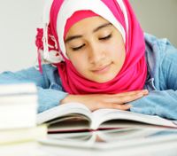 Teen girl reading a book
