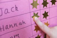 Photo of student pointing to a gold star