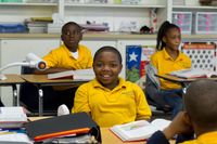Students listening to their teacher in class