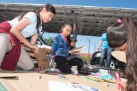 Students using cardboard in a school project