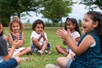 Elementary school students playing outside together