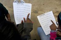 Two students reading sheet music