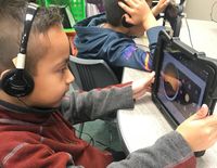 Students recording sound for a podcast