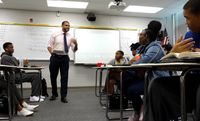 Teacher speaking in front of his class