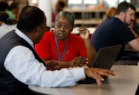 Two teachers meeting over a laptop