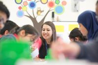 Teacher working with students in her classroom