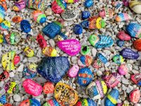 Assorted rocks painted with messages of kindness