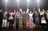 students take a bow after performing in a school play