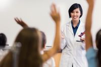 A doctor takes questions during a visit to a high school science class.