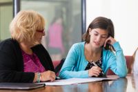 Student working with a teacher