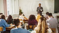 High school literature teacher lecturing his class
