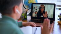 Student greets his teacher during distance learning session