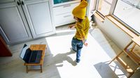 Elementary aged boy remote learning dance on laptop from home