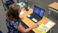 A California elementary school teacher takes attendance of her virtual distance learning class