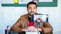 Teacher records a lesson on his phone