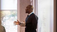 Teacher gives presentation in classroom