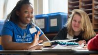 Small group of middle school students works together