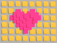 Heart made out of pink post-its surrounded by yellow post-its