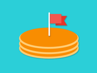 Stack of pancakes with a flag in the middle
