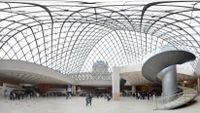 Panoramic view from under the glass pyramid at the Louvre in Paris.