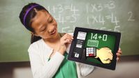 A girl looks at a math app on a tablet screen.