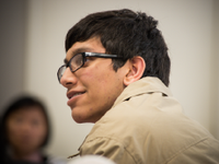Photo of a young man listening attentively