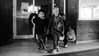 Photo of school children leaving building