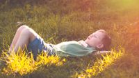 photo of a student in the grass