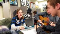 Boys playing guitar and singing