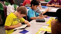 Students in class working at their desks