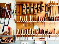 Many, many tools organized by type hanging on pegs