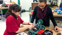 Photo of students working on robot