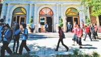Kids walking in front of the school