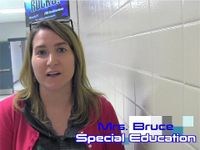 A female teacher standing in a school hallway. The words Mrs. Bruce and Special Education are imposed on the photo.