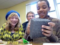 photo of a group of students working together on a project