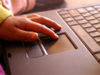 photo of student using a laptop computer