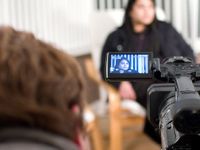 photo of a student learning with video