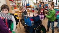 Elementary school classroom with child in wheelchair