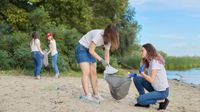 Teens clean up beach for community service.
