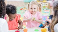 Pre-k students play with clay in school