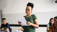 High school student reading from a written paper