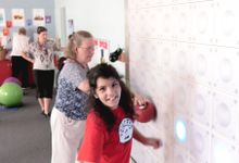 photo of a student using a light wall