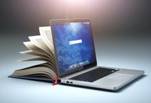 一台电脑和一本书，显示了数字化学习的新挑战。