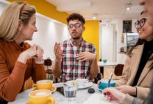 Group of teachers talking over coffee