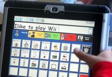 Child uses Dynavox alternative communication device