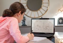 Teenage girl at home on computer remote learning