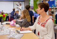 Educator observes teacher in the classroom