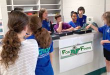 A team of students manages a school store together.